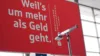 Plakat beim Sparkassentag ,,Weil's um mehr als Geld geht.''
